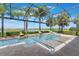 Beautiful pool area with lounge chairs, a fire bowl feature, and a scenic view of the surrounding landscape at 14285 United Colonies Dr, Winter Garden, FL 34787