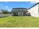 Spacious backyard with lush green grass, enclosed by a white fence, offering privacy and room for recreation at 14639 Winter Stay Dr, Winter Garden, FL 34787
