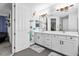 Bright bathroom featuring dual vanities, stylish lighting, and playful sea-themed decor for a cheerful atmosphere at 14639 Winter Stay Dr, Winter Garden, FL 34787