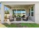 Inviting covered patio features comfortable seating and decorative string lights at 14639 Winter Stay Dr, Winter Garden, FL 34787