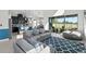 Open-concept living room with modern furniture, seamless flow to the kitchen and outdoor spaces at 14639 Winter Stay Dr, Winter Garden, FL 34787