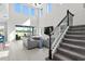 Spacious living room with high ceilings, large windows, and access to the backyard at 14639 Winter Stay Dr, Winter Garden, FL 34787