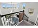 Spacious loft with large windows, a ceiling fan, and views of the living area below at 14639 Winter Stay Dr, Winter Garden, FL 34787
