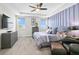 Serene main bedroom showcasing tray ceilings, with lots of natural light, creating a peaceful retreat at 14639 Winter Stay Dr, Winter Garden, FL 34787