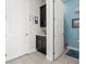 Functional mudroom features cabinets for storage and access to a bathroom at 14639 Winter Stay Dr, Winter Garden, FL 34787