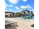 Community splash pad with water features and plenty of lounge chairs at 14639 Winter Stay Dr, Winter Garden, FL 34787