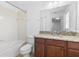 Bathroom showcasing a granite vanity, tile flooring, and bathtub with shower at 14706 Driftwater Dr, Winter Garden, FL 34787