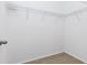 Walk-in closet featuring wire shelving and wood-look flooring at 14706 Driftwater Dr, Winter Garden, FL 34787