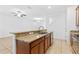 Well-designed kitchen with a granite breakfast bar and stainless steel sink at 14706 Driftwater Dr, Winter Garden, FL 34787