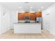 Kitchen with granite counter seating area, stainless appliances and ample cabinet storage at 14706 Driftwater Dr, Winter Garden, FL 34787