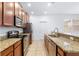 Modern kitchen featuring stainless steel appliances and granite countertops at 14706 Driftwater Dr, Winter Garden, FL 34787
