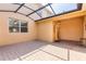Enclosed outdoor patio with brick pavers and shaded cover, ideal for entertaining at 14706 Driftwater Dr, Winter Garden, FL 34787