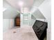 Spacious attic with light blue walls, carpeting, and access to an additional area at 1511 New York Ave, St Cloud, FL 34769