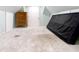 Attic with light blue walls, stained carpeting, and storage space at 1511 New York Ave, St Cloud, FL 34769