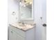 Bathroom featuring a sink, mirror, and towel rack at 1511 New York Ave, St Cloud, FL 34769