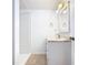 Bathroom featuring a sink, mirror, and shower at 1511 New York Ave, St Cloud, FL 34769