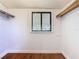 Walk-in closet featuring wood-style flooring and built-in shelving at 1511 New York Ave, St Cloud, FL 34769