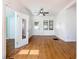 Spacious living room with sleek flooring, bright white walls, and natural light from multiple windows at 1511 New York Ave, St Cloud, FL 34769