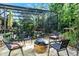 Backyard features a fire pit and seating area outside the screened pool enclosure at 162 Seville Chase Dr, Winter Springs, FL 32708