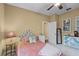 Cozy bedroom with bright window, floral headboard, and decorative accents at 162 Seville Chase Dr, Winter Springs, FL 32708