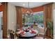 Dining area with large windows offering natural light and backyard view at 162 Seville Chase Dr, Winter Springs, FL 32708