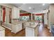 Open-concept kitchen with granite countertops, stainless steel appliances, and breakfast bar seating at 162 Seville Chase Dr, Winter Springs, FL 32708
