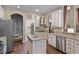 Spacious kitchen featuring stainless steel appliances, granite countertops and custom cabinets at 162 Seville Chase Dr, Winter Springs, FL 32708