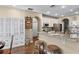 Bright kitchen with granite countertops, stainless steel appliances, and a breakfast bar with seating at 162 Seville Chase Dr, Winter Springs, FL 32708