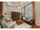 Cozy living room with hardwood floors and large window providing lots of natural light at 162 Seville Chase Dr, Winter Springs, FL 32708