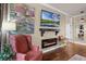 Cozy living room features a sleek, modern fireplace, hardwood floors, and decorative lighting at 162 Seville Chase Dr, Winter Springs, FL 32708