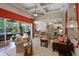 Open-concept living room with coffered ceilings, views to the dining area, kitchen and lanai at 162 Seville Chase Dr, Winter Springs, FL 32708