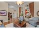 Living room with hardwood floors, neutral colors, and lots of natural light at 162 Seville Chase Dr, Winter Springs, FL 32708