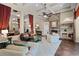 Spacious living room with fireplace, coffered ceilings, and an open layout to the dining area at 162 Seville Chase Dr, Winter Springs, FL 32708