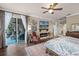 Comfortable main bedroom with fireplace, sitting area, and private access to the patio at 162 Seville Chase Dr, Winter Springs, FL 32708