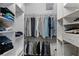 Organized walk-in closet with shelving and rods for efficient storage of clothes at 162 Seville Chase Dr, Winter Springs, FL 32708