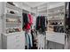 Spacious walk-in closet with custom shelves, drawers and hanging rods at 162 Seville Chase Dr, Winter Springs, FL 32708