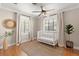 Bright Bedroom featuring wood floors, soft neutral colors, and a stylish woven rug at 1701 Canton Street, Orlando, FL 32803