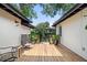 An inviting outdoor deck with chairs and potted plants offers a relaxing space at 1701 Canton Street, Orlando, FL 32803