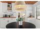 Charming dining area with wood ceiling, open shelving, and stylish décor adjacent to the kitchen at 1701 Canton Street, Orlando, FL 32803