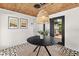 Bright dining area features a wood ceiling, modern pendant lighting, and stylish flooring at 1701 Canton Street, Orlando, FL 32803
