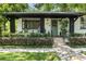 Charming single Gathering home featuring an inviting front porch and updated black and white exterior at 1701 Canton Street, Orlando, FL 32803