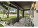 Inviting front porch showcasing slate flooring, black railings, and comfortable seating area at 1701 Canton Street, Orlando, FL 32803