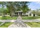 Inviting home with a well-manicured lawn and charming walkway, creating a welcoming entrance at 1701 Canton Street, Orlando, FL 32803