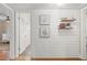 Decorated hallway with white wood paneling, modern decor, and hardwood floors at 1701 Canton Street, Orlando, FL 32803