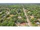 Birds eye view of the house showing its street proximity, and surrounding greenery on a bright day at 2229 N 6Th St, Orlando, FL 32820