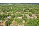 Scenic aerial view of the house in its natural environment with lush greenery and other houses nearby at 2229 N 6Th St, Orlando, FL 32820