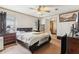 Cozy bedroom featuring a comfortable bed, wood-toned furniture and an ensuite bathroom at 2229 N 6Th St, Orlando, FL 32820