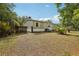 View of the side of the house with wooden fence at 2229 N 6Th St, Orlando, FL 32820