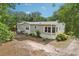 Charming single Gathering home with mature landscaping and a cozy sunroom, nestled in a peaceful, tree-lined neighborhood at 2229 N 6Th St, Orlando, FL 32820