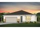 Charming single-story home featuring a two-car garage and well-maintained landscaping at 2291 Mossy Vine Ave, St Cloud, FL 34771